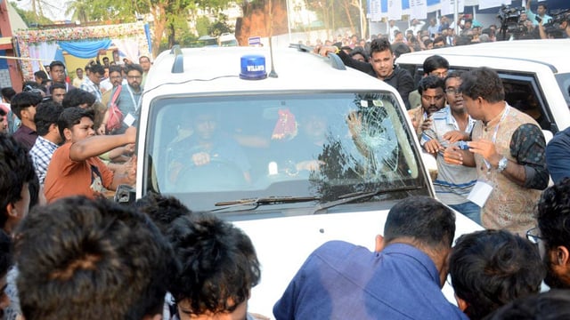 Students' Federation of India (SFI) members gather around West Bengal Education Minister Bratya Basu's car at Jadavpur University campus, in Kolkata, Saturday, March 1, 2025.