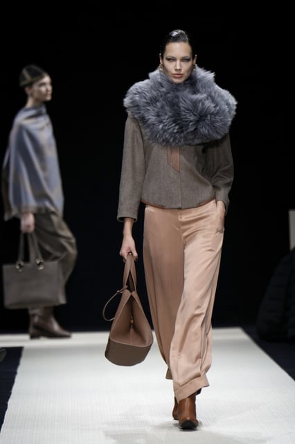 A model wears a creation as part of the Giorgio Armani Fall/Winter 2025-2026 Women's collection presented in Milan, Italy, Sunday, March 2, 2025. (AP Photo/Luca Bruno)
