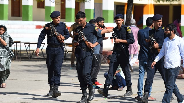 Haryana police commando deployed during the Gurugram Civic Body Elections at Government Senior Secondary School in Nathupur village near DLF phase-3, in Gurugram, India, on Sunday, 02 March 2025.