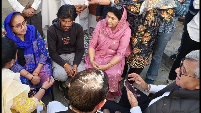 MLA Bharat Bhushan Batra reached Himani Narwal's house to console her mother in Rohtak on Sunday. (Manoj Dhaka/HindustanTimes)