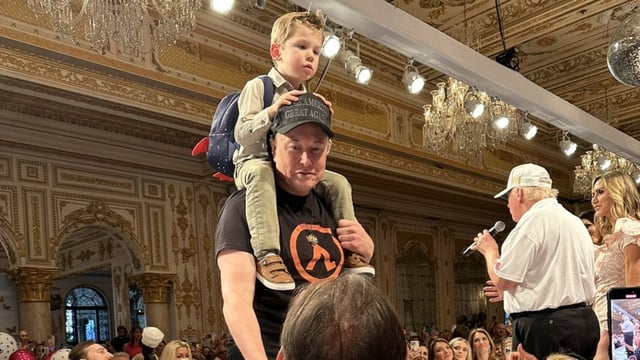 Elon Musk with son Lil X at a Mar-a-Lago event.