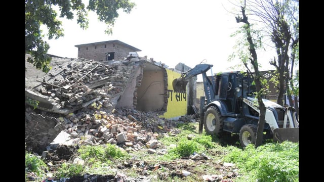 A house of a drug smuggler being demolished in Phillaur on Sunday. (HT)
