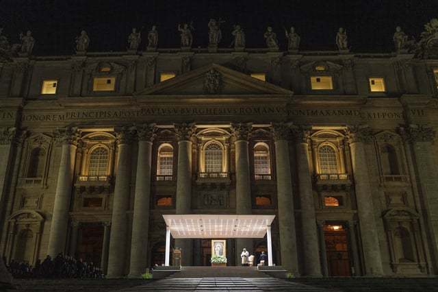 Cardinal Konrad Krajewski, Almsman of His Holiness, leads a nightly rosary prayer for the health of Pope Francis in St. Peter's Square at the Vatican, Sunday, March 2, 2025. (AP Photo/Mosa'ab Elshamy)