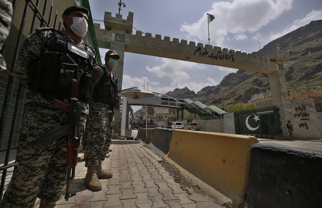 FILE -Pakistani paramilitary soldiers stand guard at Torkham border crossing, in Khyber district, Pakistan, Tuesday, Aug. 3, 2021. (AP Photo/Anjum Naveed, File)