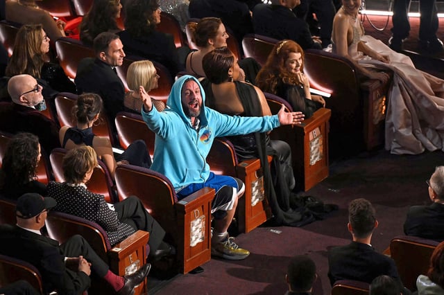 Adam Sandler stormed out the Oscars in casualwear.