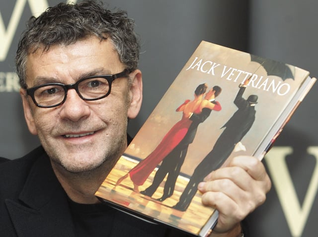 FILE - Scottish artist Jack Vettriano holds up a copy of his new book ahead of a signing session held at a London bookstore, Friday Oct. 29, 2004. (AP Photo/Richard Lewis, File)