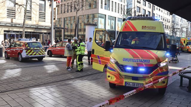 Emergency services and police stand at Paradeplatz in Mannheim, Germany, after a serious incident on Monday.