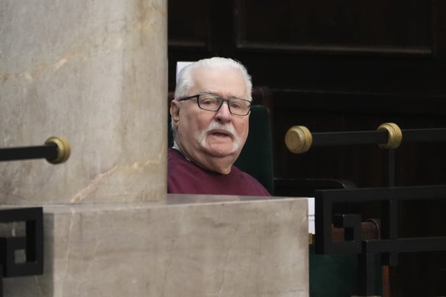 FILE - Poland's former president and Nobel Peace Prize winner, Lech Walesa, is greeted at parliament in Warsaw, Poland, Dec. 11, 2023. (AP Photo/Czarek Sokolowski, File)