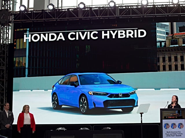 DETROIT, MICHIGAN - JANUARY 10: The Honda Civic Hybrid is announced as the winner of the Car of the Year award at the North American Car, Truck, and Utility Vehicle of the Year Awards at the 2025 Detroit Auto Show at Huntington Place on January 10, 2025 in Detroit, Michigan. The Detroit Auto Show opens to the public on January 11th and runs through January 20th .(Photo by Bill Pugliano/Getty Images)
