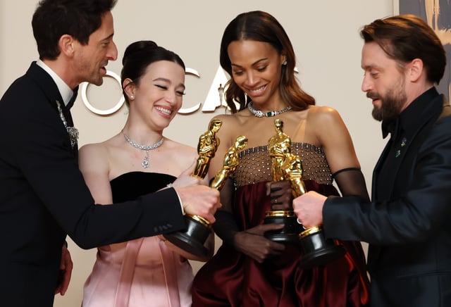 Acting winners Adrien Brody (far left), Mikey Madison, Zoe Saldana and Kieran Culkin pose with their Oscars backstage at the 97th Academy Awards.