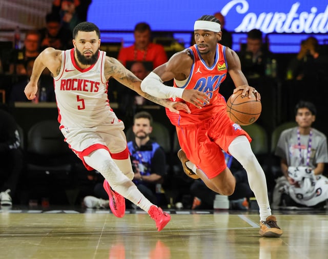 Shai Gilgeous-Alexander #2 of the Oklahoma City Thunder brings the ball up the court against Fred VanVleet #5 of the Houston Rockets in the second half of a semifinal game of the Emirates NBA Cup at T-Mobile Arena on December 14, 2024 in Las Vegas, Nevada. The Thunder defeated the Rockets 111-96.