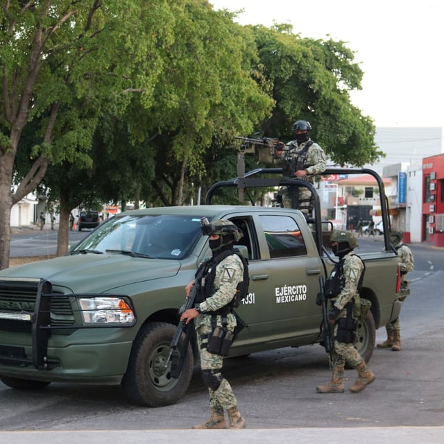 Members of the Mexican Army stand guard in the area where two members of a faction of the Sinaloa Cartel were detained during an operation by Mexican federal authorities, in Culiacan, Mexico, February 19, 2025. REUTERS/Jesus Bustamante