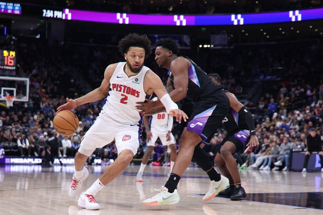 Mar 3, 2025; Salt Lake City, Utah, USA; Detroit Pistons guard Cade Cunningham (2) drives against Utah Jazz forward Brice Sensabaugh (28) during the first half at Delta Center. Mandatory Credit: Rob Gray-Imagn Images