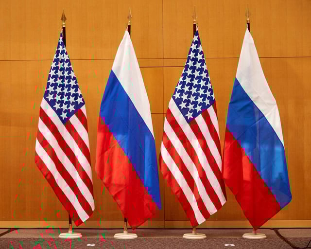 Russian and U.S. flags are pictured before talks between Russian Deputy Foreign Minister Sergei Ryabkov and U.S. Deputy Secretary of State Wendy Sherman at the United States Mission in Geneva, Switzerland January 10, 2022. REUTERS/Denis Balibouse/File Photo