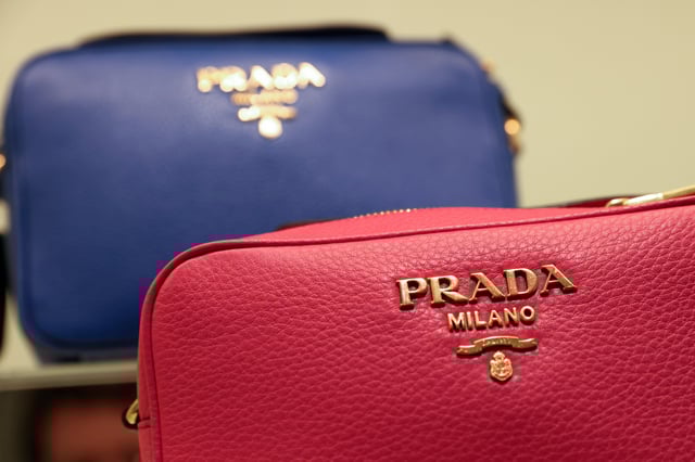 Prada products are seen at their store at the Woodbury Common Premium Outlets in Central Valley, New York, U.S., February 15, 2022. REUTERS/Andrew Kelly/File Photo
