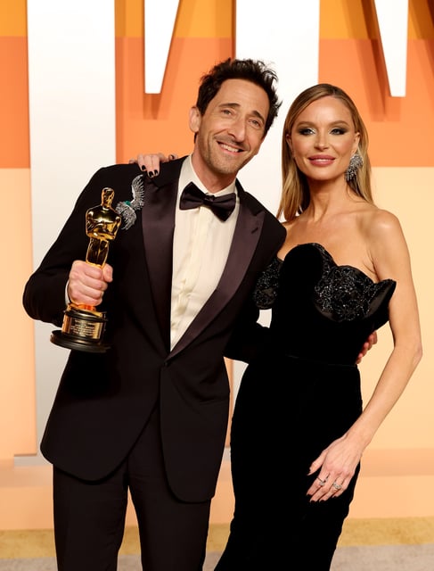 Adrien Brody, left, and Georgina Chapman attend the Vanity Fair Oscar Party on March 2, 2025.