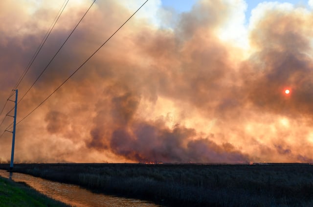 A stock photo shows a wildfire burning in Texas.