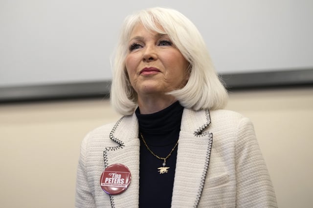 Candidate Tina Peters speaks during a debate for the state leadership position Saturday, Feb. 25, 2023, in Hudson, Colo.