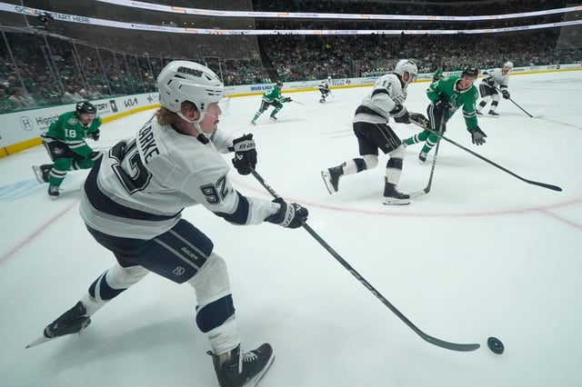 Kings defenseman Brandt Clarke passes the puck against the Dallas Stars during the first period Friday, Feb. 28, 2025, in Dallas. (AP Photo/Julio Cortez)