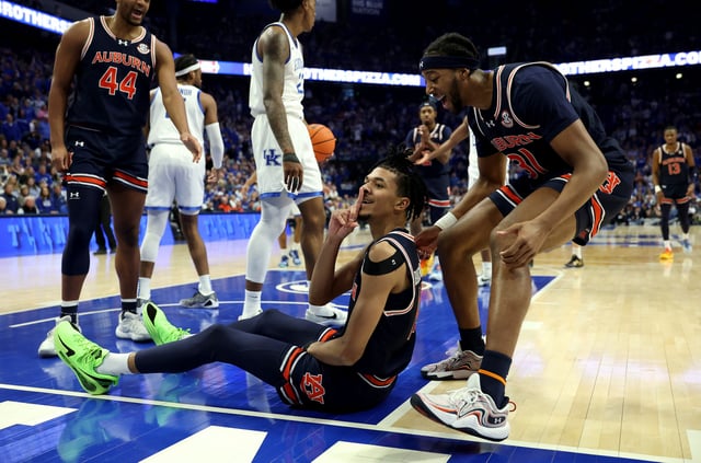 Chad Baker-Mazara #10 of the Auburn Tigers gestures to the student section of the Kentucky Wildcats after scoring a basket during the game at Rupp Arena on March 01, 2025 in Lexington, Kentucky. Auburn beat Kentucky 94-78 .