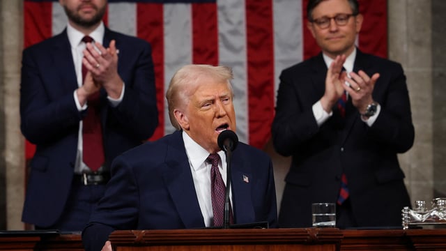 US President Donald Trump addresses a joint session of Congress at the US Capitol on March 04, 2025 in Washington, DC. Vice President JD Vance and Speaker of the House Mike Johnson (R-LA) applaud behind.