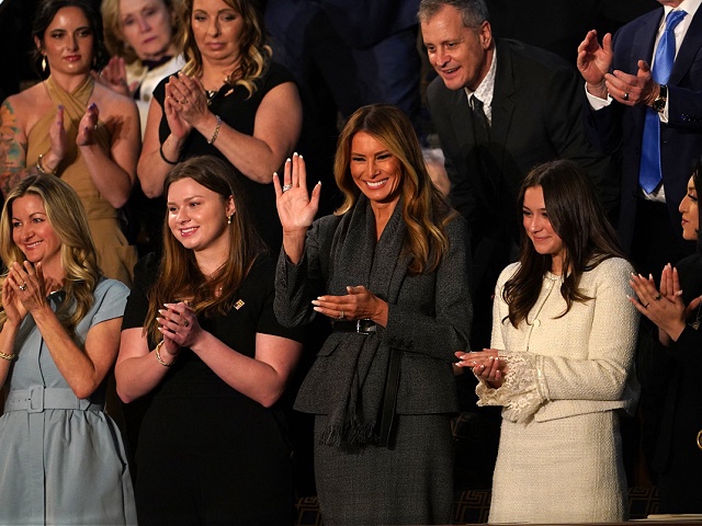 US First Lady Melania Trump (C) waves as she attends US President Donald Trump's address to a joint session of Congress in the House Chamber of the US Capitol in Washington, DC, on March 4, 2025. (Photo by ALLISON ROBBERT / AFP) (Photo by ALLISON ROBBERT/AFP via Getty Images)