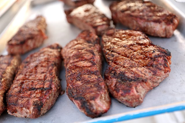 Stock photograph showing a view of steak being prepared during the Food Network&#39;s New York City Wine &amp; Food Festival at Brooklyn Army Terminal on October 19, 2024 in New York City.