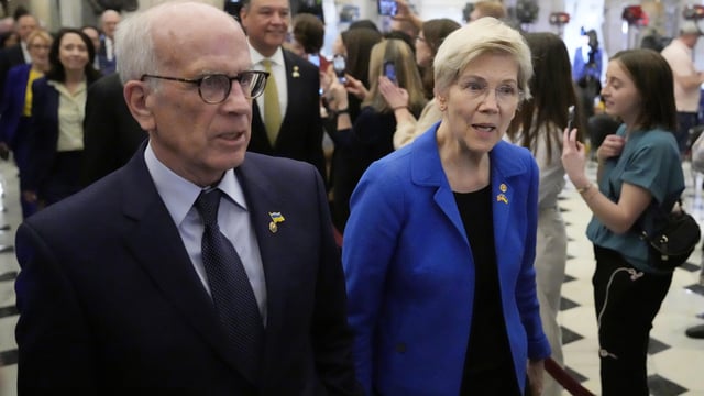 Sen. Elizabeth Warren, D-Mass., and Sen. Peter Welch, D-Vt., left, arrive before President Donald Trump addresses a joint session of Congress at the Capitol in Washington, Tuesday, March 4, 2025. (AP Photo/Ben Curtis)