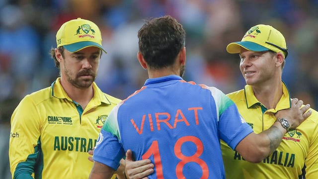 India's Virat Kohli with Australia's Travis Head and captain Steve Smith
