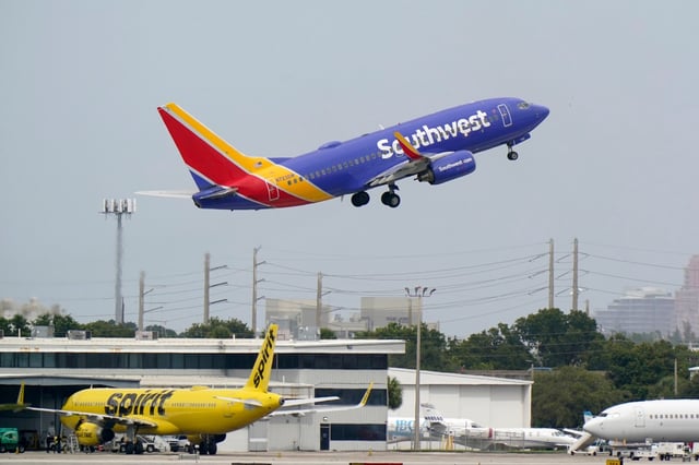 Scores of flyers in and out of South Florida had their plans scuttled Friday as planes were stuck amid the chaotic weather. In this file photo, a Southwest Airlines Boeing 737-7H4 takes off from Fort Lauderdale-Hollywood International Airport in Fort Lauderdale.