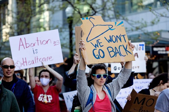 People march through 8th Street in downtown Boise, Idaho, on May 3, 2022, in response to the news that the US Supreme Court could be poised to overturn the landmark Roe v. Wade case that legalized abortion nationwide.
