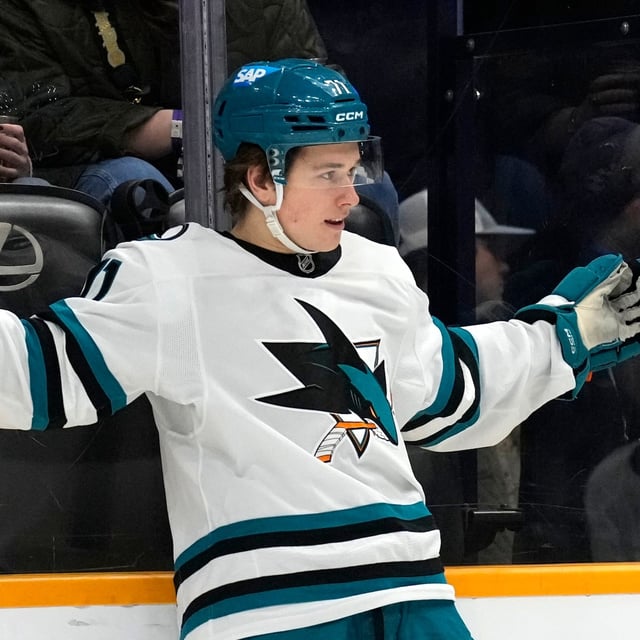 FILE- San Jose Sharks center Macklin Celebrini celebrates after scoring a goal against the Nashville Predators during the first period of an NHL hockey game, Tuesday, Jan. 21, 2025, in Nashville, Tenn. (AP Photo/Mark Humphrey, File)
