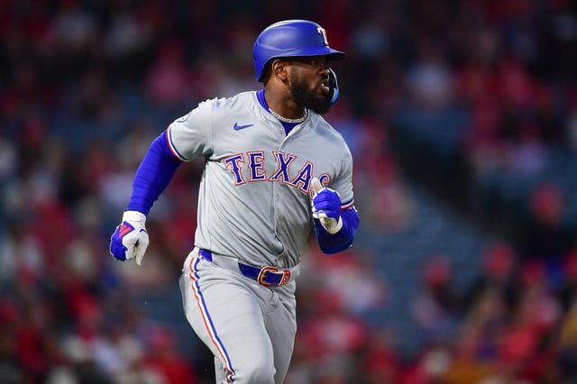 Sep 27, 2024; Anaheim, California, USA; Texas Rangers right fielder Adolis Garcia (53) hits a solo home run against the Los Angeles Angels during the first inning at Angel Stadium. Mandatory Credit: Gary A. Vasquez-Imagn Images/File Photo