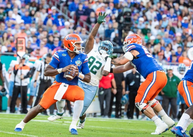 Florida Gators defensive lineman Desmond Watson (21) picks up Tulane Green Wave quarterback Ty Thompson (7) for a sack during the Gasparilla Bowl at Raymond James Stadium in Tampa, Fla., Friday, Dec. 20, 2024. (Willie J. Allen Jr./Orlando Sentinel)