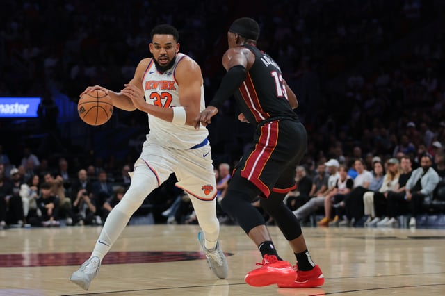 Mar 2, 2025; Miami, Florida, USA; New York Knicks center Karl-Anthony Towns (32) drives to the basket against Miami Heat center Bam Adebayo (13) during the second quarter at Kaseya Center. Mandatory Credit: Sam Navarro-Imagn Images/File Photo