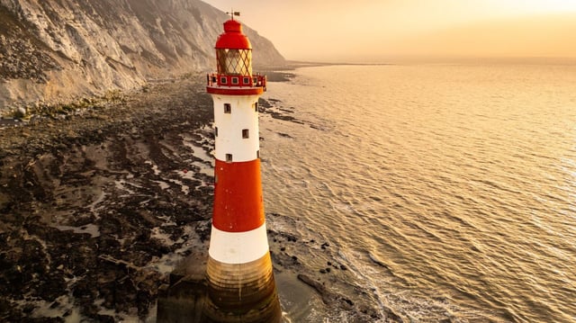 The morning sun hits Beachy Head lighthouse in East Sussex, but cooler weather is to come