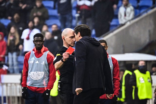 Millot prepares to show Fonseca a red card.