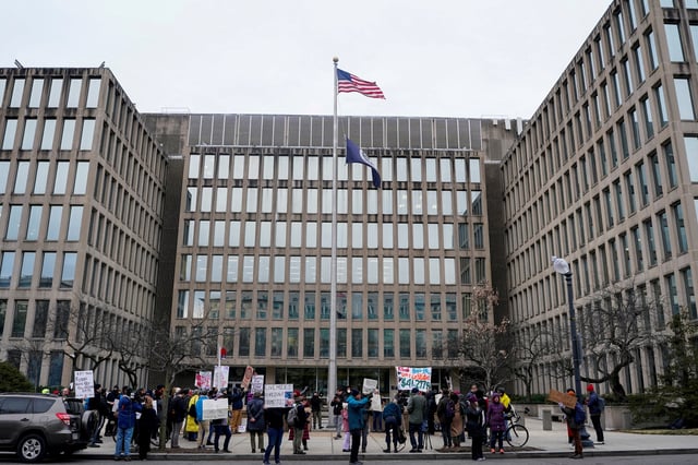 Demonstrators rally during a protest against billionaire Elon Musk, who is heading U.S. President Donald Trump's drive to shrink the federal government, outside the U.S. Office of Personnel Management (OPM) in Washington, U.S., February 5, 2025. REUTERS/Nathan Howard/File Photo