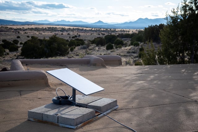 A Starlink satellite on the roof of a home in Galisteo, New Mexico, US, on Monday, March 18, 2024. Starlink is a satellite-based internet provider owned by SpaceX.