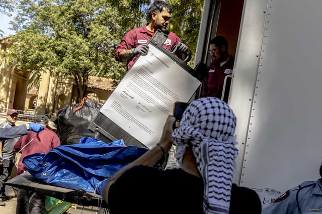 Workers remove a letter from Stanford University to the pro-Palestinian student encampment at White Plaza on June 5, 2024, after protesters briefly occupied the president’s office.