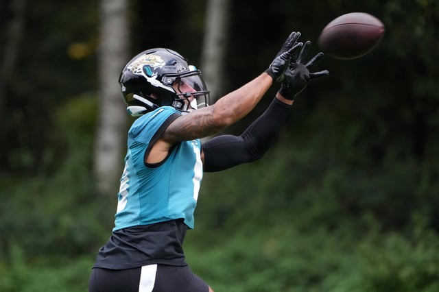 Oct 16, 2024; Watford, United Kingdom; Jacksonville Jaguars wide receiver Christian Kirk (13) catches the ball during practice at The Grove. Mandatory Credit: Kirby Lee-Imagn Images/File Photo