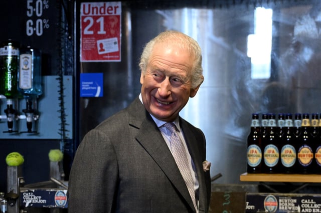 Britain's King Charles reacts during a visit to the Tower Brewery in Burton-Upon-Trent, Britain, February 24, 2025. REUTERS/Jaimi Joy/Pool/File Photo