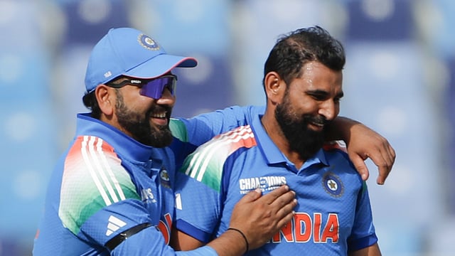 Mohammed Shami and Rohit Sharma celebrate the dismissal of Australia's captain Steven Smith during the 1st Semi-Final (A1 v B2) in the ICC Champions Trophy, 2025, at Dubai International Cricket Stadium in Dubai on Tuesday. 