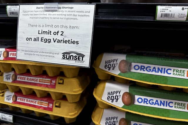 A sign is mounted on a shelve of eggs at a grocery store in Northbrook, Ill., Friday, Feb. 28, 2025. (AP Photo/Nam Y. Huh)