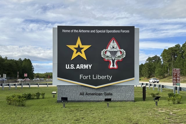 Vehicles pass a sign for Fort Liberty, an Army installation near Fayetteville, N.C., on Tuesday, Oct. 1, 2024. The name was changed from Fort Bragg in 2023, but Defense Secretary Pete Hegseth signed an order Monday, Feb. 10, 2024, changing it back, in honor of World War II veteran Roland L. Bragg of Maine. It was originally named for Confederate Gen. Braxton Bragg, a North Carolina native. (AP Photo/Allen G. Breed)