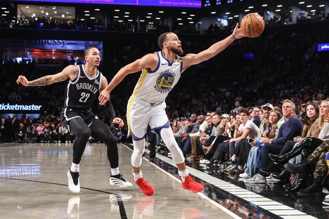 Mar 6, 2025; Brooklyn, New York, USA;  Brooklyn Nets forward Jalen Wilson (22) and Golden State Warriors guard Stephen Curry (30) chase after a loose ball in the first quarter at Barclays Center. Mandatory Credit: Wendell Cruz-Imagn Images