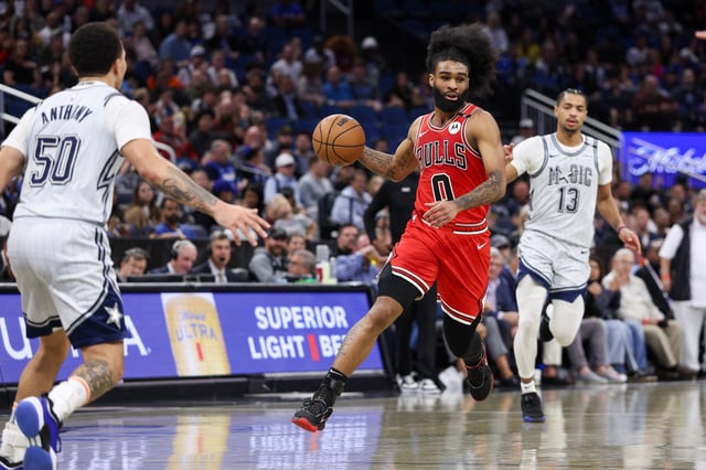 Mar 6, 2025; Orlando, Florida, USA; Chicago Bulls guard Coby White (0) controls the ball against the Orlando Magic in the third quarter at Kia Center. Mandatory Credit: Nathan Ray Seebeck-Imagn Images