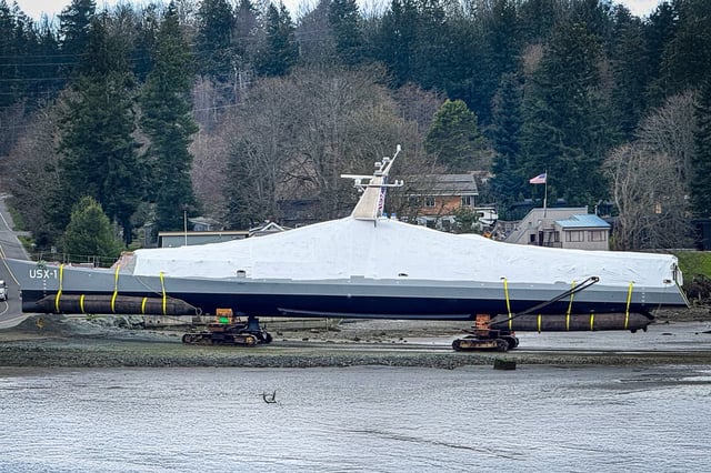 Image (extended using generative tools) of the Defiant being towed for launch