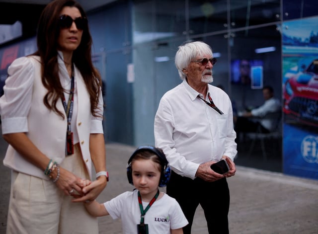 Formula One F1 - Brazilian Grand Prix - Jose Carlos Pace Circuit, Sao Paulo, Brazil - November 5, 2023 Former chief executive of the Formula One Group Bernie Ecclestone with his wife Fabiana Flosi and son Ace at the circuit before the race REUTERS/Amanda Perobelli/File Photo
