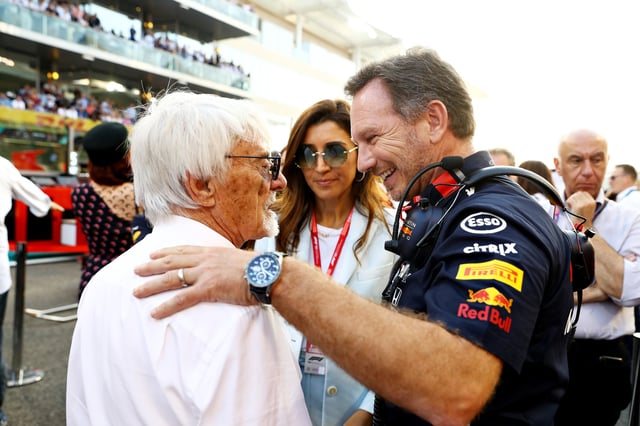 Red Bull Racing Team Principal Christian Horner talks with Bernie Ecclestone, Chairman Emeritus of the Formula One Group, on the grid before the F1 Grand Prix of Abu Dhabi at Yas Marina Circuit on December 01, 2019 in Abu Dhabi, United Arab Emirates.